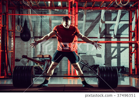Young athlete practicing crossfit training Young athlete practicing crossfit training 37496351