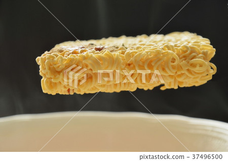 instant noodles floating on hot water in bowl instant noodles floating on hot water in bowl 37496500