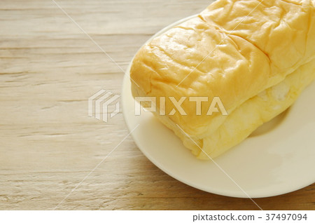 butter bread loaf on white dish  37497094