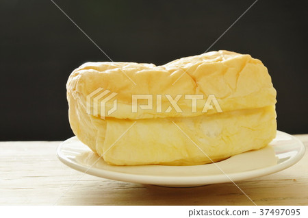 butter bread loaf on white dish  37497095