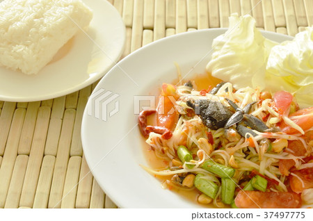 Somtum Thai spicy green papaya with black crab Somtum Thai spicy green papaya with black crab 37497775