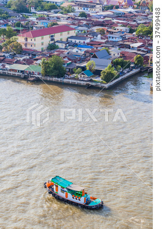Tugboat brings cargo in Chao Phraya River Tugboat brings cargo in Chao Phraya River 37499488