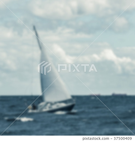 Blue sailboat - blurred image 37500409