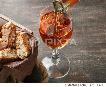 Italian cantucci biscuits and a glass of wine 37501371