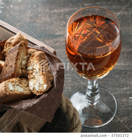 Italian cantucci biscuits and a glass of wine Italian cantucci biscuits and a glass of wine 37501372