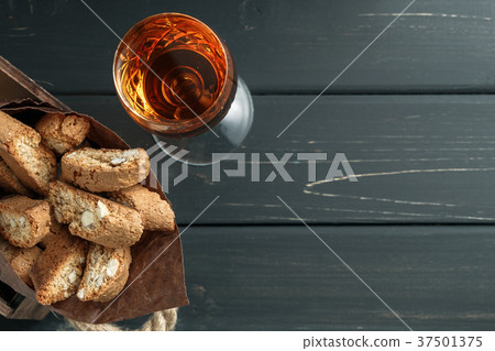 Italian cantucci biscuits and a glass of wine Italian cantucci biscuits and a glass of wine 37501375