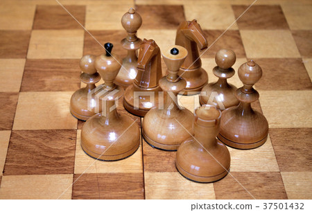 White chess pieces on a chess board 37501432