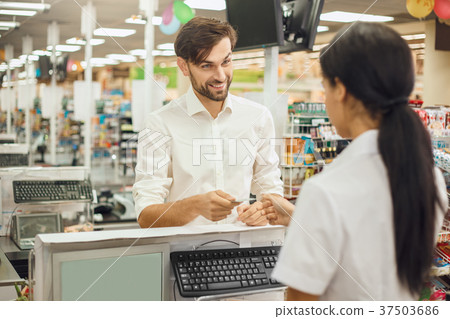 Man buying food products in the supermarket Man buying food products in the supermarket 37503686