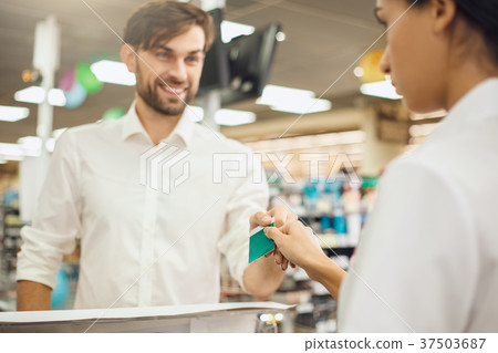 Man buying food products in the supermarket Man buying food products in the supermarket 37503687