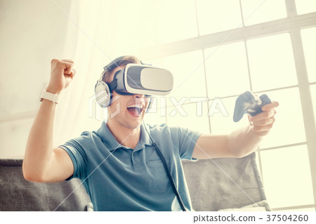 Man wearing virtual reality headset modern Man wearing virtual reality headset modern 37504260