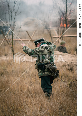 A German soldier is being taken prisoner 37509436