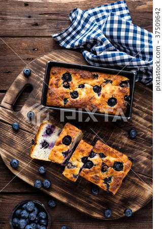 Cheesecake with blueberry on wooden background 37509642