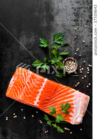 Fresh salmon fish fillet on black background 37509643