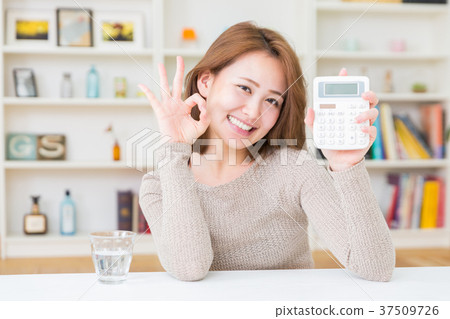 Woman with a calculator Woman with a calculator 37509726