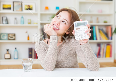 Woman with a calculator Woman with a calculator 37509727