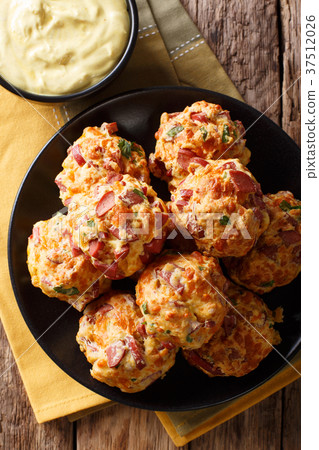Freshly baked delicious sausage balls with cheese Freshly baked delicious sausage balls with cheese 37512026