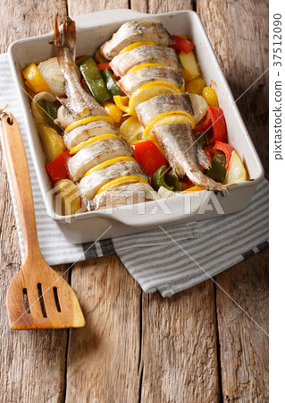 Atlantic cod fish baked with pepper, tomatoes Atlantic cod fish baked with pepper, tomatoes 37512090