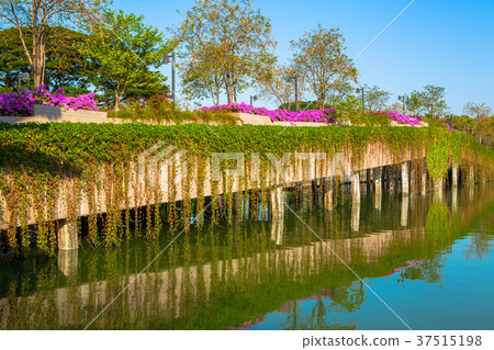 Stone Bridge in a park with lake on blue sky 37515198