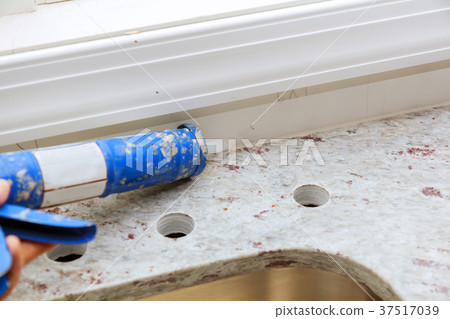 Contractor installing a granite counter tops Contractor installing a granite counter tops 37517039