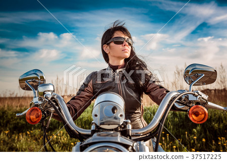 Woman resting near motorhomes in nature.  Woman resting near motorhomes in nature.  37517225