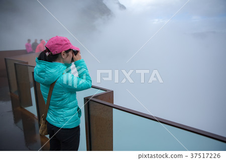 Woman resting near motorhomes in nature.  Woman resting near motorhomes in nature.  37517226