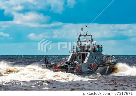 Grey military ship at sea Grey military ship at sea 37517671
