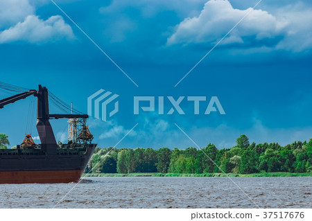 Blue cargo ship underway Blue cargo ship underway 37517676