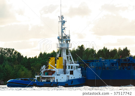 Blue tug ship underway Blue tug ship underway 37517742