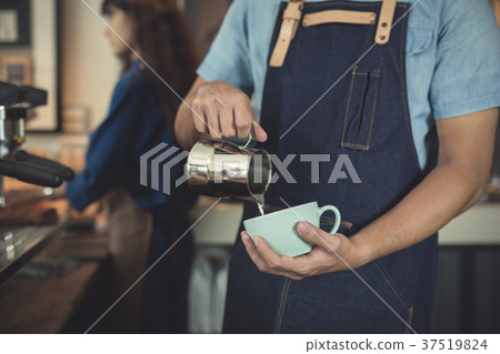 closeup hands asian man barista making coffee in coffeshop 37519824