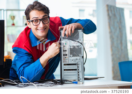 Computer repairman working on repairing computer Computer repairman working on repairing computer 37520193