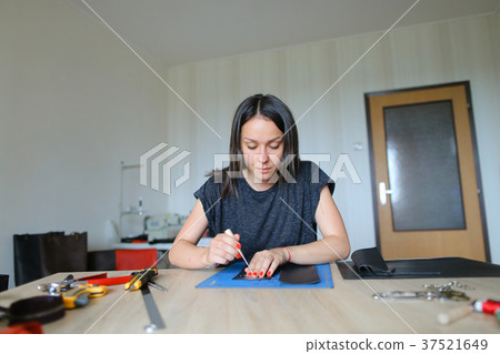Slow motion girl preparing leather for mak 37521649
