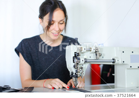 seamstress discussing work with boss using 37521664