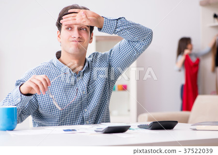 Young couple looking at family finance papers Young couple looking at family finance papers 37522039