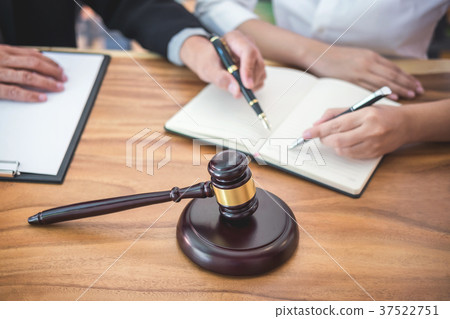 Male lawyer or judge consult having team meeting with client, La Male lawyer or judge consult having team meeting with client, La 37522751