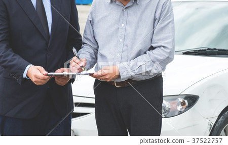 Insurance Agent examine Damaged Car and customer filing signatur Insurance Agent examine Damaged Car and customer filing signatur 37522757
