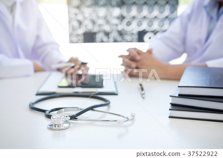 Professor Doctor discussion a method with patient treatment, res 37522922
