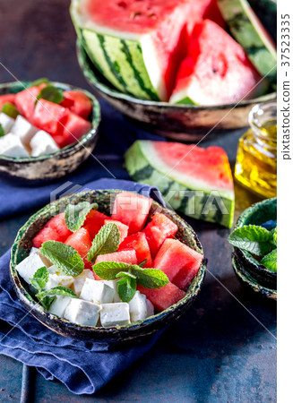 Watermelon cheese and mint salad with olive oil Watermelon cheese and mint salad with olive oil 37523335