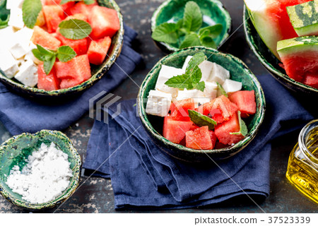 Watermelon cheese and mint salad with olive oil 37523339