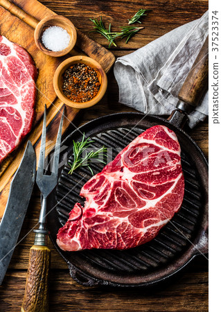 Raw marbled beef steak on grill pan 37523374