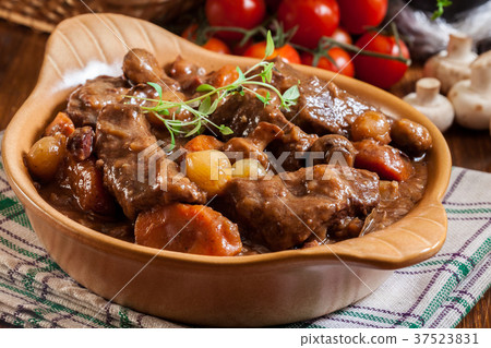 Beef Bourguignon stew served with baguette Beef Bourguignon stew served with baguette 37523831