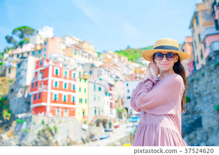 Young woman with great view at old village Young woman with great view at old village 37524620