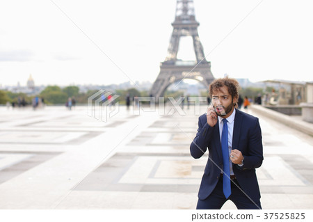 Mulatto boy speaking with girlfriend by phone near Mulatto boy speaking with girlfriend by phone near 37525825