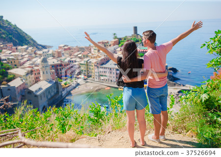 Happy family with view of the old coastal town Happy family with view of the old coastal town 37526694