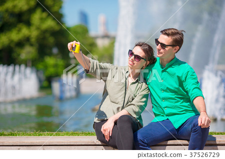Couple taking a selfie background the fountain 37526729