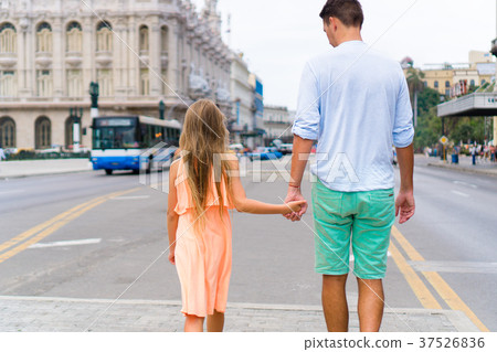 Tourist girl and father in popular area in Havana Tourist girl and father in popular area in Havana 37526836