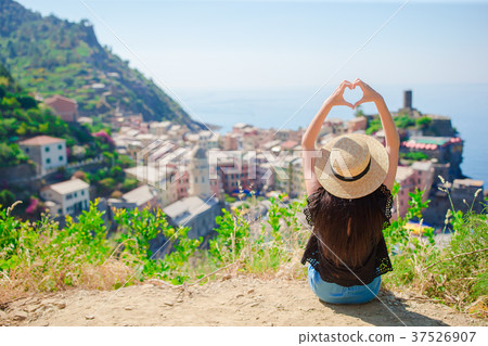 Beautiful girl making with hands heart shape on 37526907