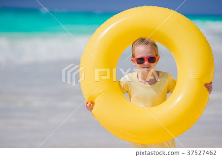 Portrait of little girl with inflatable rubber Portrait of little girl with inflatable rubber 37527462
