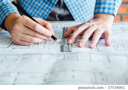 Architect or engineer working in office blueprint 37539061