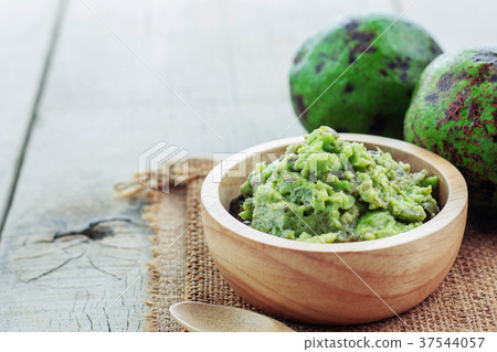 Avocado in bowl on floor. Avocado in bowl on floor. 37544057