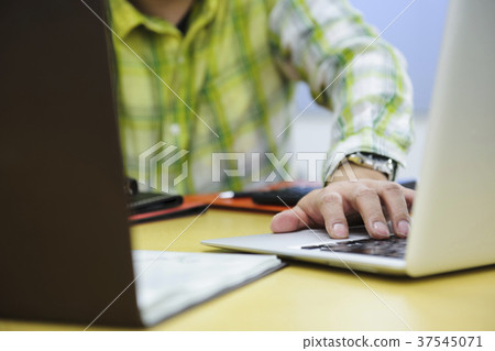 Businessman working Businessman working 37545071